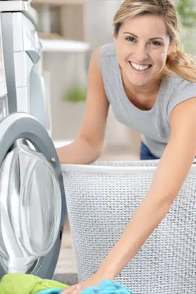 sexy young MILF - phone sex girl but also a mum, doing the laundry but looking sexy doing it.